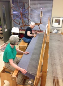 Weaving on the guild's 100" loom