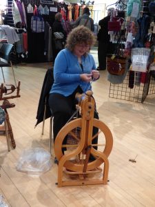 Cindy spinning on a wheel